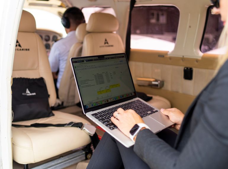 Traveler sitting in Aerocaribe private charter plane at Costa Rica airport, stress-free departure